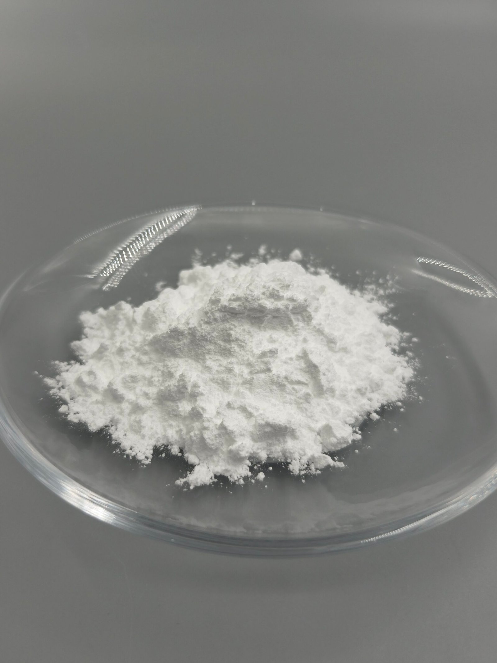 High-purity lithium niobate (LiNbO₃) powder for optoelectronics and ceramic applications, showing fine granules suitable for sintered ceramics, optical devices, and advanced photonic components